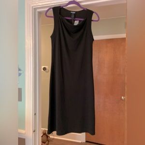 Adorable little black dress front neck creates a little dip ,nice touch